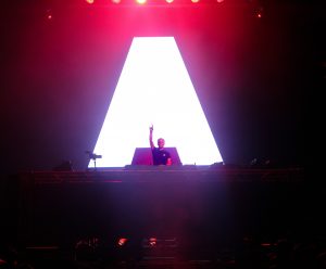 Armin Van Buuren at North Coast Music Festival in front of the A Logo
